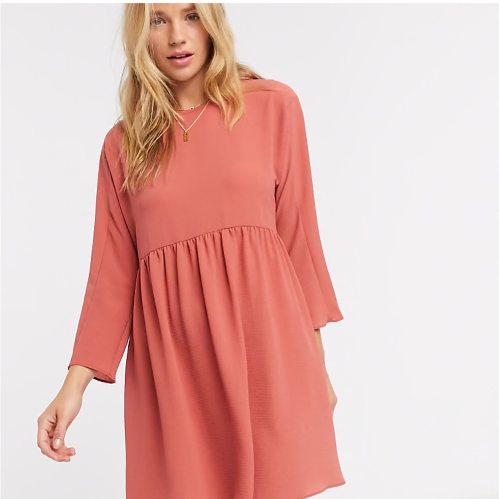 Long sleeve smock mini dress in dusty rose color.